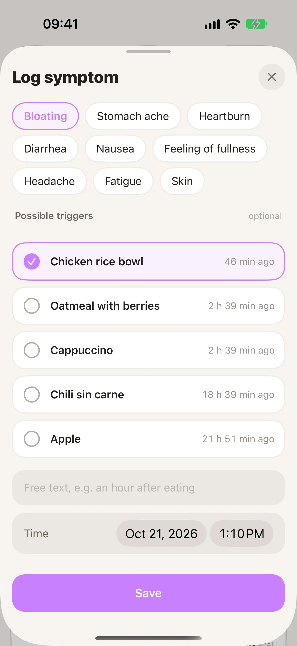 “Log symptom” screen with bloating selected and the chicken rice bowl as a possible trigger